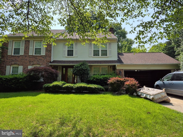 13209 Marthas Choice Cir, Bowie, MD 20720 - view of front of house featuring a chimney, a garage, a front lawn, and brick siding