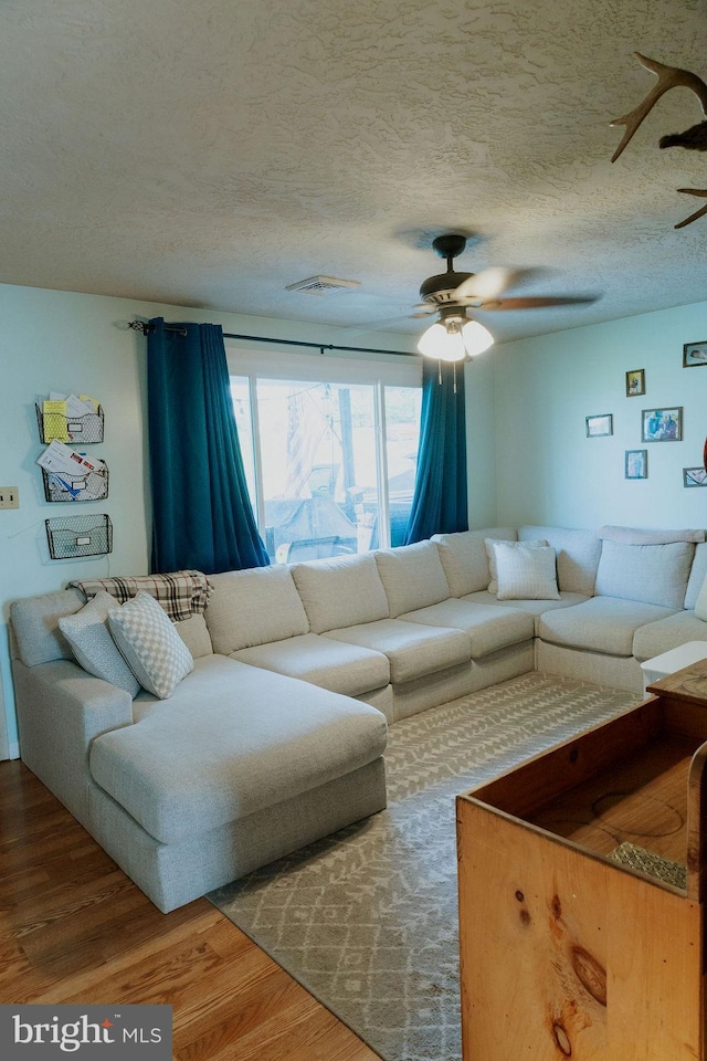 3483 Messersmith Rd, York, PA 17408 - living room with ceiling fan, wood finished floors, and a textured ceiling