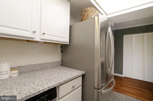 804 Stratford Dr Unit 11, State College, PA 16801 - washroom with cabinet space, wood finished floors, and washing machine and clothes dryer