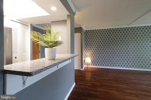 804 Stratford Dr Unit 11, State College, PA 16801 - kitchen featuring crown molding, dark wood-type flooring, and a kitchen bar