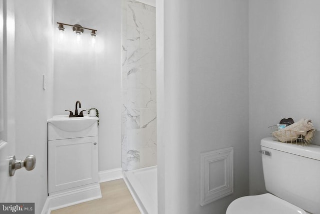 8247 River Rd, Pennsauken, NJ 08110 - bathroom featuring a marble finish shower, vanity, and wood finished floors