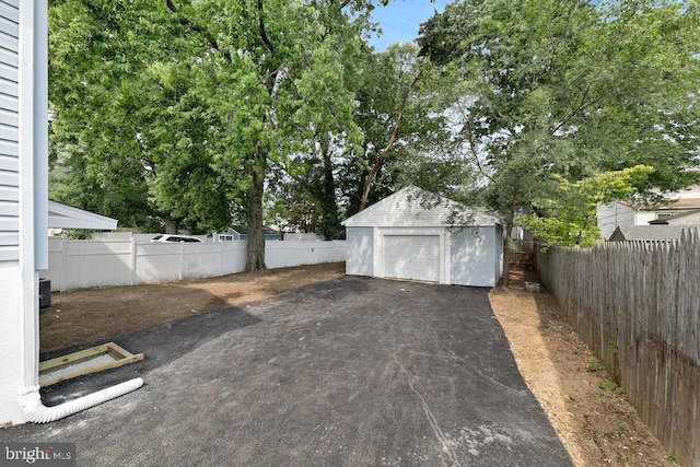 8247 River Rd, Pennsauken, NJ 08110 - detached garage featuring driveway