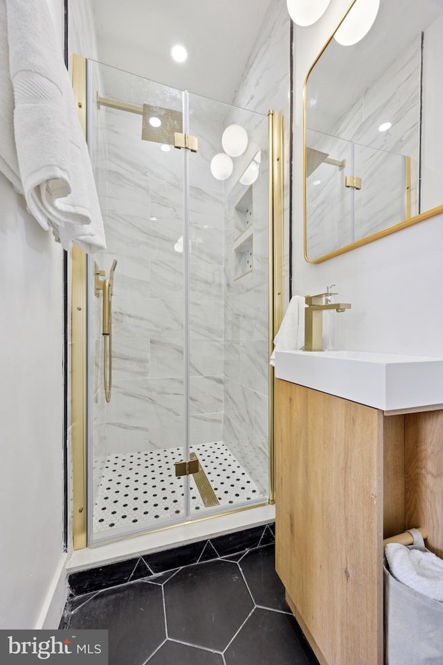 1232 S Bucknell St, Philadelphia, PA 19146 - bathroom with tile patterned flooring, vanity, and a marble finish shower
