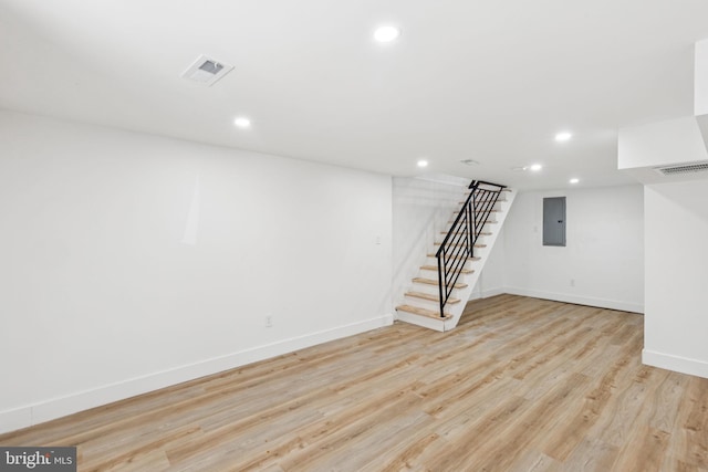 1232 S Bucknell St, Philadelphia, PA 19146 - finished below grade area featuring electric panel, stairway, recessed lighting, and light wood finished floors