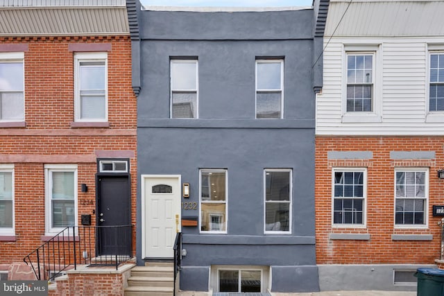 1232 S Bucknell St, Philadelphia, PA 19146 - townhome / multi-family property featuring brick siding and stucco siding
