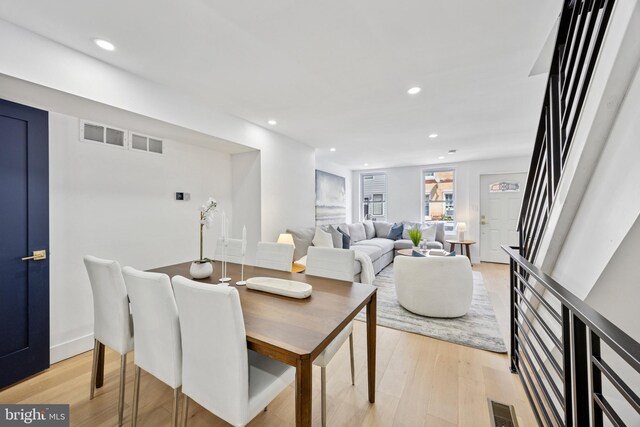 1232 S Bucknell St, Philadelphia, PA 19146 - dining space with light wood finished floors, recessed lighting, and stairs
