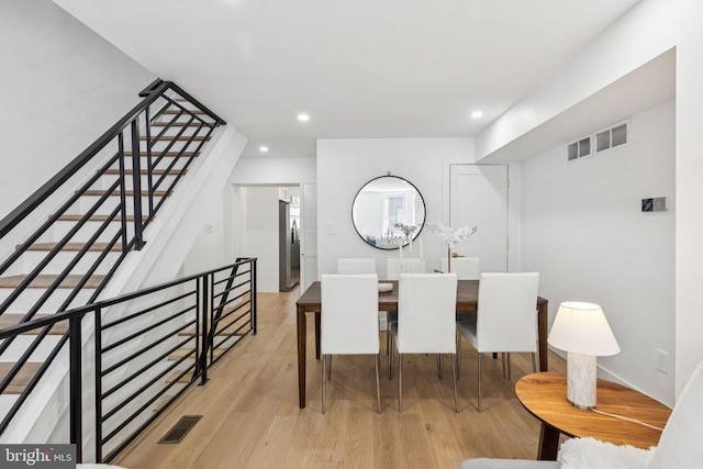 1232 S Bucknell St, Philadelphia, PA 19146 - dining room featuring wood finished floors, recessed lighting, and stairs
