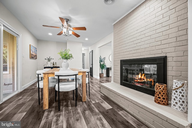 9017 Marcella Ave, Randallstown, MD 21133 - dining space featuring a brick fireplace, dark wood-type flooring, ceiling fan, and recessed lighting