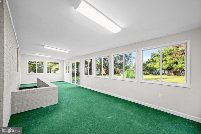 9017 Marcella Ave, Randallstown, MD 21133 - unfurnished sunroom with baseboards and carpet