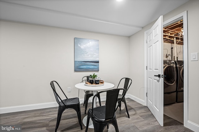 9017 Marcella Ave, Randallstown, MD 21133 - dining space featuring washer and dryer and dark wood finished floors