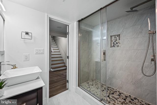 9017 Marcella Ave, Randallstown, MD 21133 - full bathroom featuring a stall shower, vanity, and marble look tiles