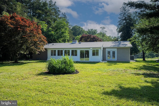 9017 Marcella Ave, Randallstown, MD 21133 - view of front facade featuring french doors, a front lawn, and a chimney