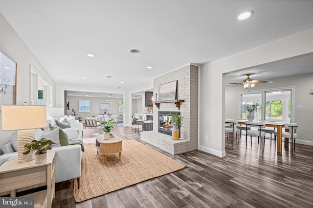 9017 Marcella Ave, Randallstown, MD 21133 - living room featuring dark wood-style floors, a fireplace, recessed lighting, and ceiling fan