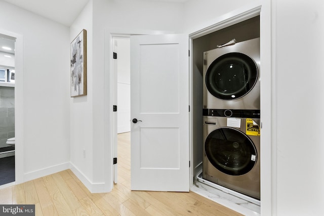 7214 16th Ave, Takoma Park, MD 20912 - washroom with estacked washer and dryer and wood finished floors