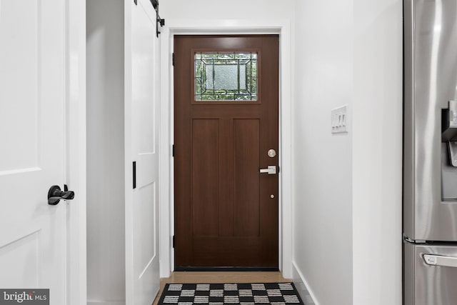 7214 16th Ave, Takoma Park, MD 20912 - doorway to outside with baseboards and a barn door