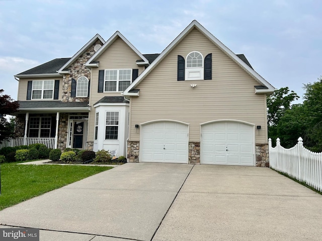 15 Boraten Cir, Royersford, PA 19468 - traditional-style home featuring stone siding, concrete driveway, and a garage