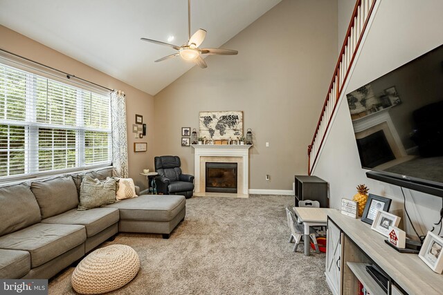 15 Boraten Cir, Royersford, PA 19468 - living room with a fireplace with flush hearth, a ceiling fan, high vaulted ceiling, and light colored carpet