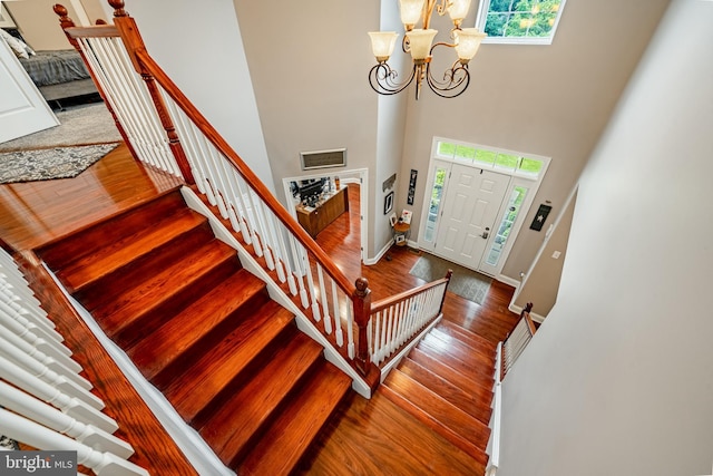 15 Boraten Cir, Royersford, PA 19468 - foyer with plenty of natural light, a chandelier, a high ceiling, wood finished floors, and stairs