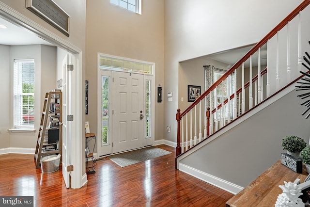 15 Boraten Cir, Royersford, PA 19468 - entryway featuring wood finished floors, healthy amount of natural light, stairway, and a high ceiling