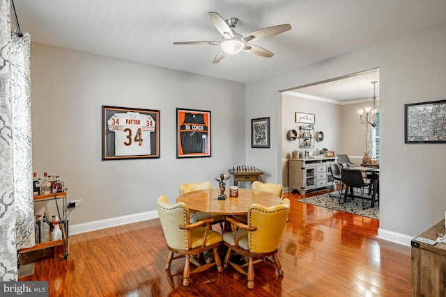 15 Boraten Cir, Royersford, PA 19468 - dining area featuring wood finished floors, ceiling fan, ornamental molding, and a chandelier