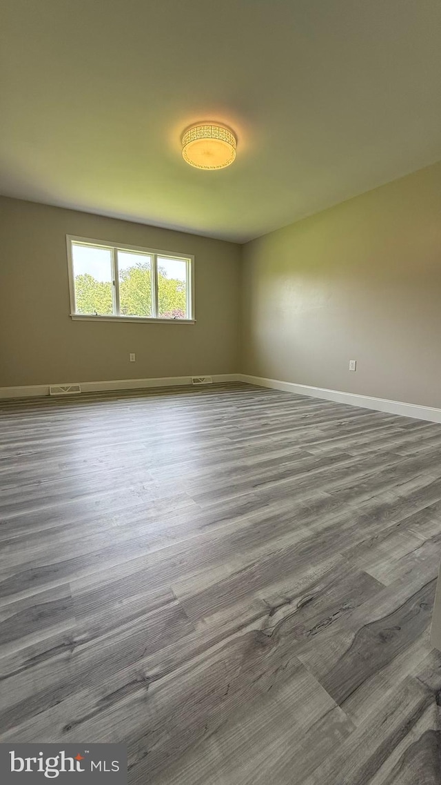 104 Lake Front Dr, Dover, DE 19904 - empty room with baseboards and wood finished floors