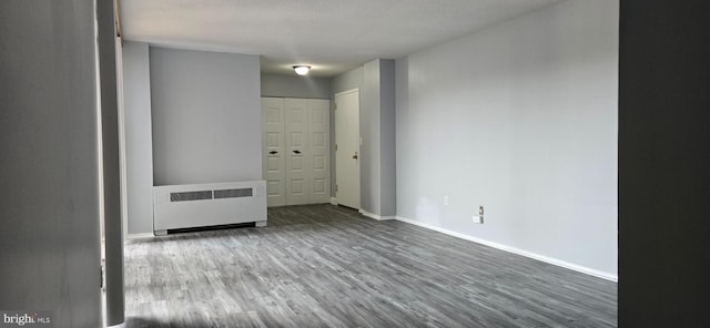 6100 Westchester Park Dr Unit 520, College Park, MD 20740 - unfurnished room featuring radiator and wood finished floors