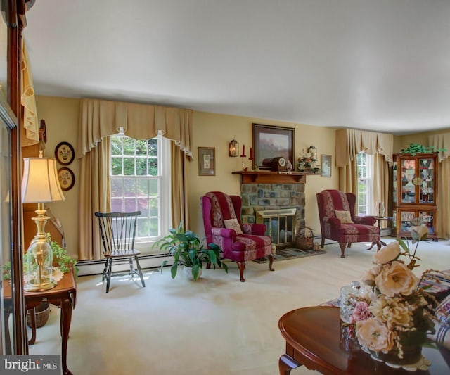 11733 Woodlea Dr, Waynesboro, PA 17268 - carpeted living room featuring a baseboard heating unit, plenty of natural light, and a stone fireplace