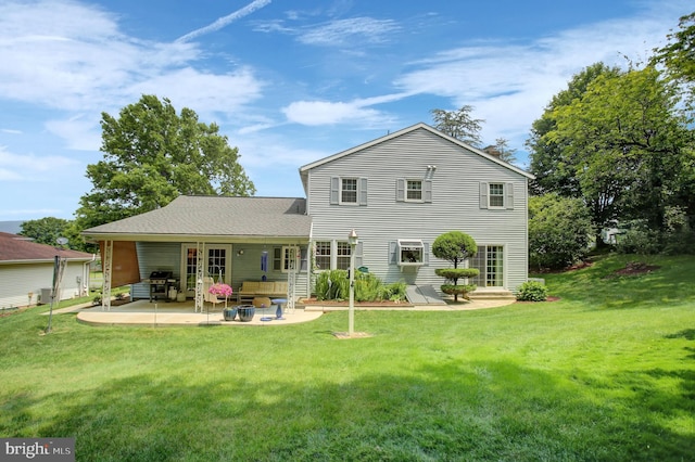 11733 Woodlea Dr, Waynesboro, PA 17268 - back of property with a patio area and a lawn