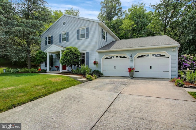 11733 Woodlea Dr, Waynesboro, PA 17268 - view of front of home featuring a garage, driveway, a front lawn, and a shingled roof