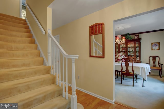 11733 Woodlea Dr, Waynesboro, PA 17268 - stairway with a chandelier and wood finished floors