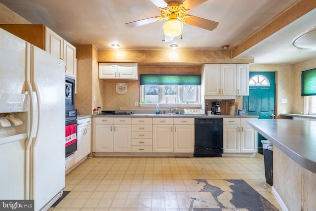 2151 Spinnerstown Rd, Quakertown, PA 18951 - kitchen featuring black appliances, white cabinets, and light countertops