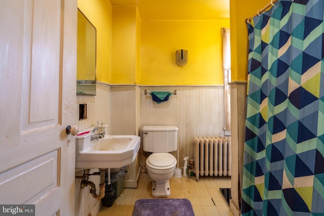 2151 Spinnerstown Rd, Quakertown, PA 18951 - full bath featuring radiator heating unit, a wainscoted wall, and curtained shower