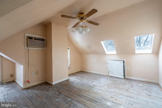 2151 Spinnerstown Rd, Quakertown, PA 18951 - bonus room with a skylight, a wall unit AC, lofted ceiling, hardwood / wood-style flooring, and a ceiling fan