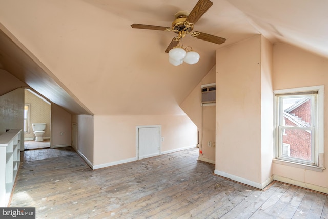 2151 Spinnerstown Rd, Quakertown, PA 18951 - additional living space with lofted ceiling, wood-type flooring, ceiling fan, and a wall unit AC