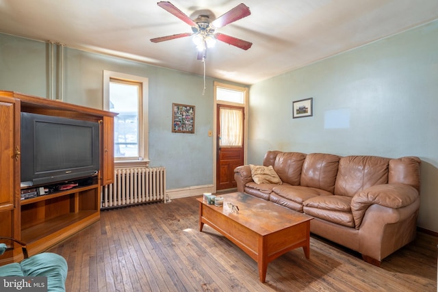 2151 Spinnerstown Rd, Quakertown, PA 18951 - living area with radiator heating unit, ceiling fan, and hardwood / wood-style floors