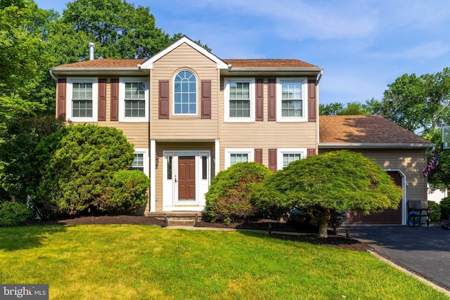 5960 Captain Milton E Major Ave, Bensalem, PA 19020 - view of front facade with a garage, asphalt driveway, and a front lawn