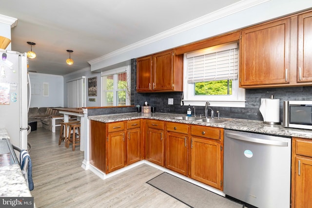 5960 Captain Milton E Major Ave, Bensalem, PA 19020 - kitchen with stainless steel appliances, light wood-style flooring, a peninsula, crown molding, and plenty of natural light