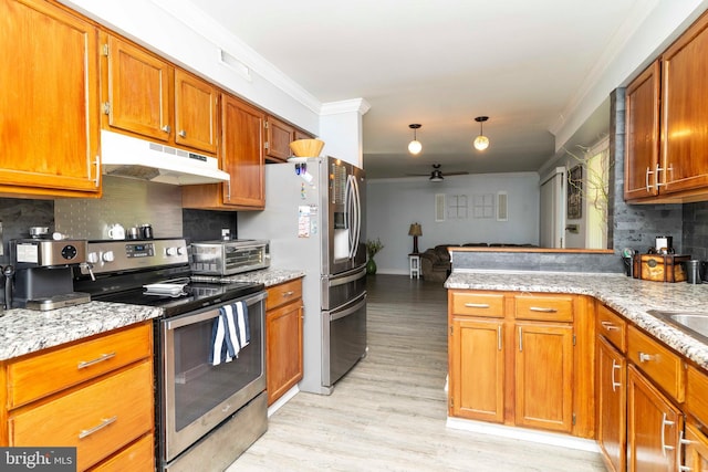 5960 Captain Milton E Major Ave, Bensalem, PA 19020 - kitchen with stainless steel appliances, under cabinet range hood, ornamental molding, a ceiling fan, and backsplash