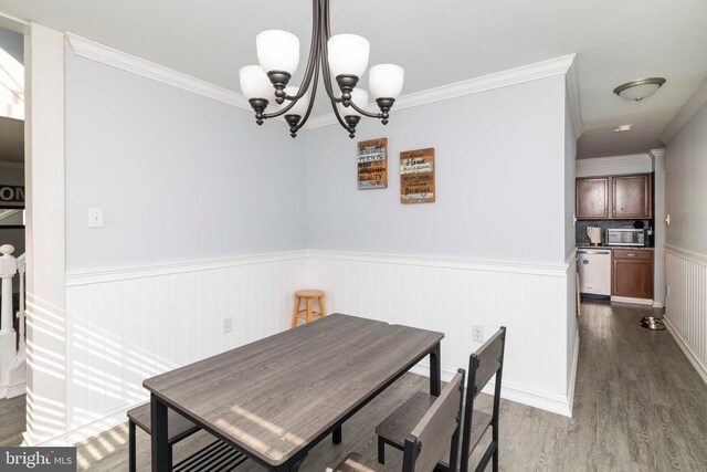 5960 Captain Milton E Major Ave, Bensalem, PA 19020 - dining space with a wainscoted wall, ornamental molding, wood finished floors, and a chandelier