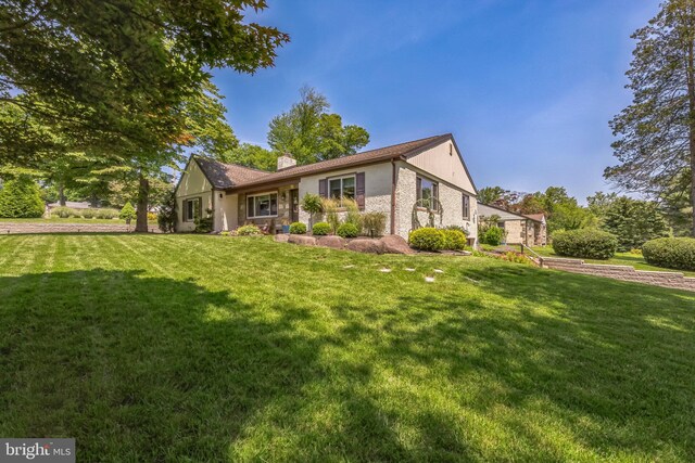 22 Indian Path Ln, Feasterville Trevose, PA 19053 - view of front of home featuring a front lawn, a chimney, and brick siding