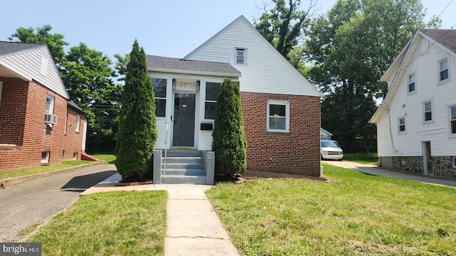 2011 Englewood Ave, Baltimore, MD 21207 - bungalow-style house with a front lawn and brick siding