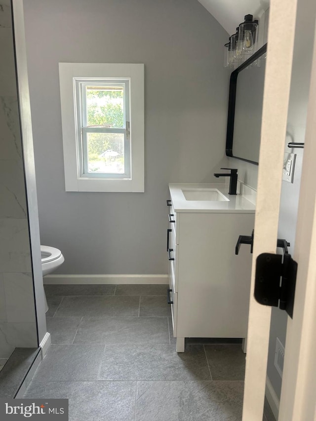 2011 Englewood Ave, Baltimore, MD 21207 - bathroom with vanity, vaulted ceiling, and tile patterned flooring