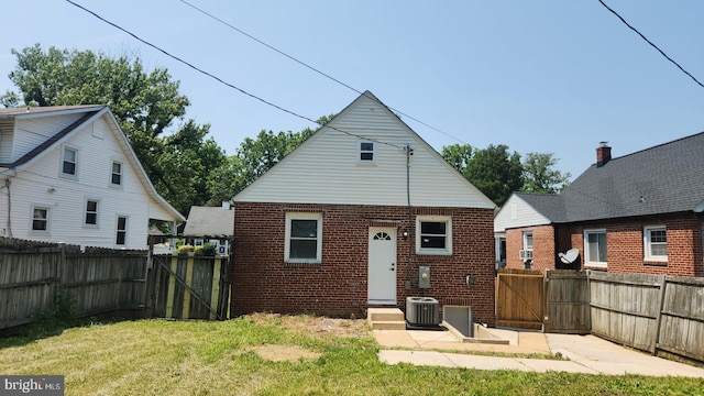 2011 Englewood Ave, Baltimore, MD 21207 - rear view of property featuring a gate, a fenced backyard, and brick siding