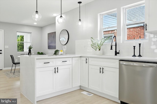 2011 Englewood Ave, Baltimore, MD 21207 - kitchen featuring dishwasher, light wood-style floors, tasteful backsplash, a peninsula, and recessed lighting