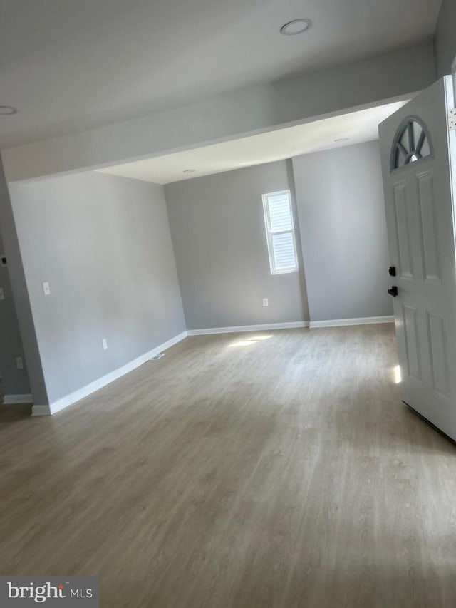 2011 Englewood Ave, Baltimore, MD 21207 - empty room with wood finished floors and baseboards