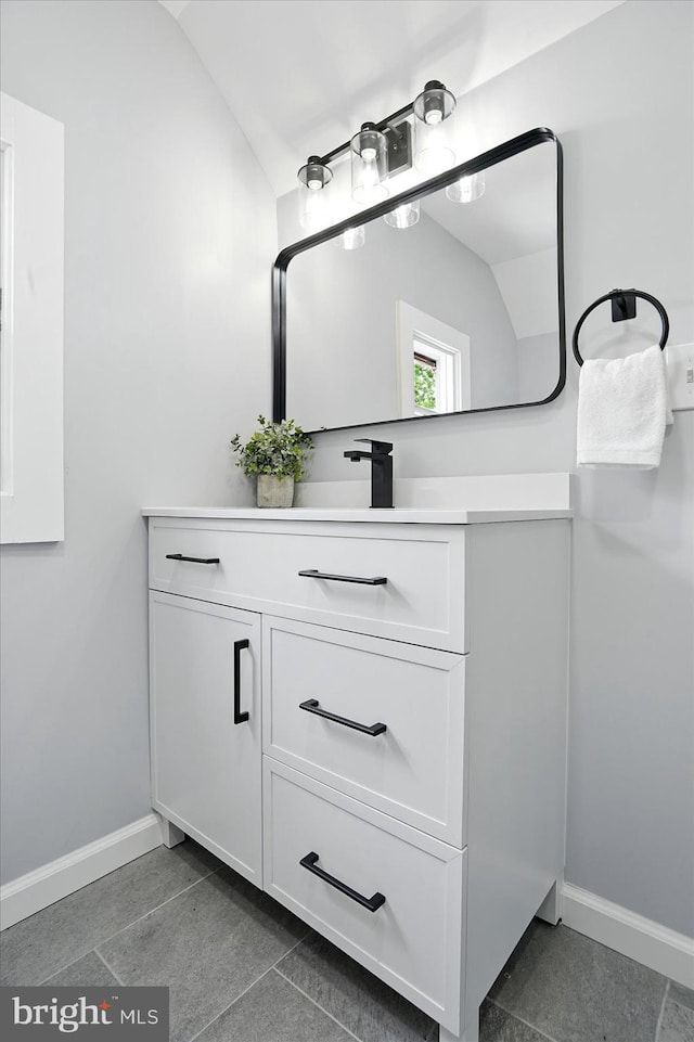 2011 Englewood Ave, Baltimore, MD 21207 - bathroom featuring vaulted ceiling and vanity