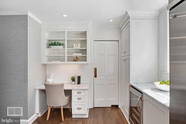 4731 Butterworth Pl NW, Washington, DC 20016 - office with dark wood-style floors, ornamental molding, beverage cooler, built in desk, and recessed lighting