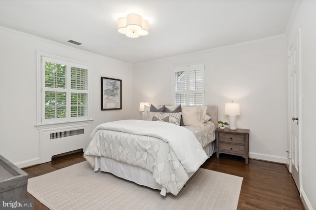 4731 Butterworth Pl NW, Washington, DC 20016 - bedroom featuring radiator, dark wood-type flooring, and crown molding