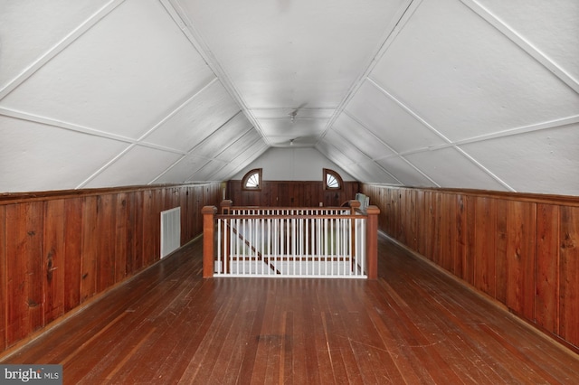 4731 Butterworth Pl NW, Washington, DC 20016 - additional living space with wooden walls, hardwood / wood-style flooring, and vaulted ceiling
