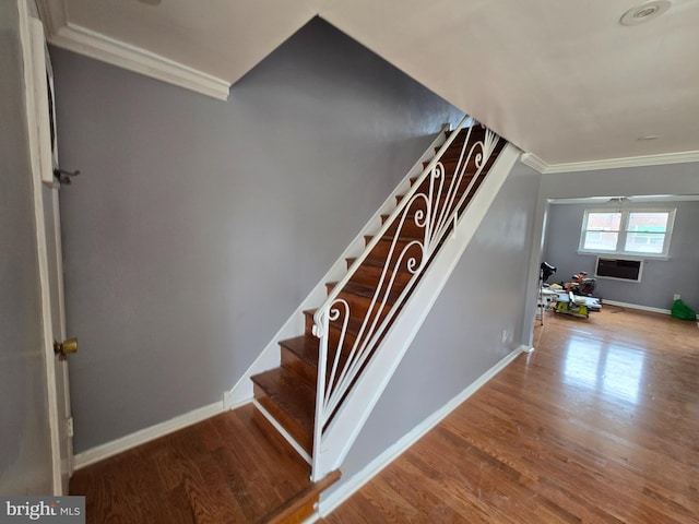 5903 Algon Ave, Philadelphia, PA 19149 - staircase with crown molding, wood finished floors, and a wall mounted AC